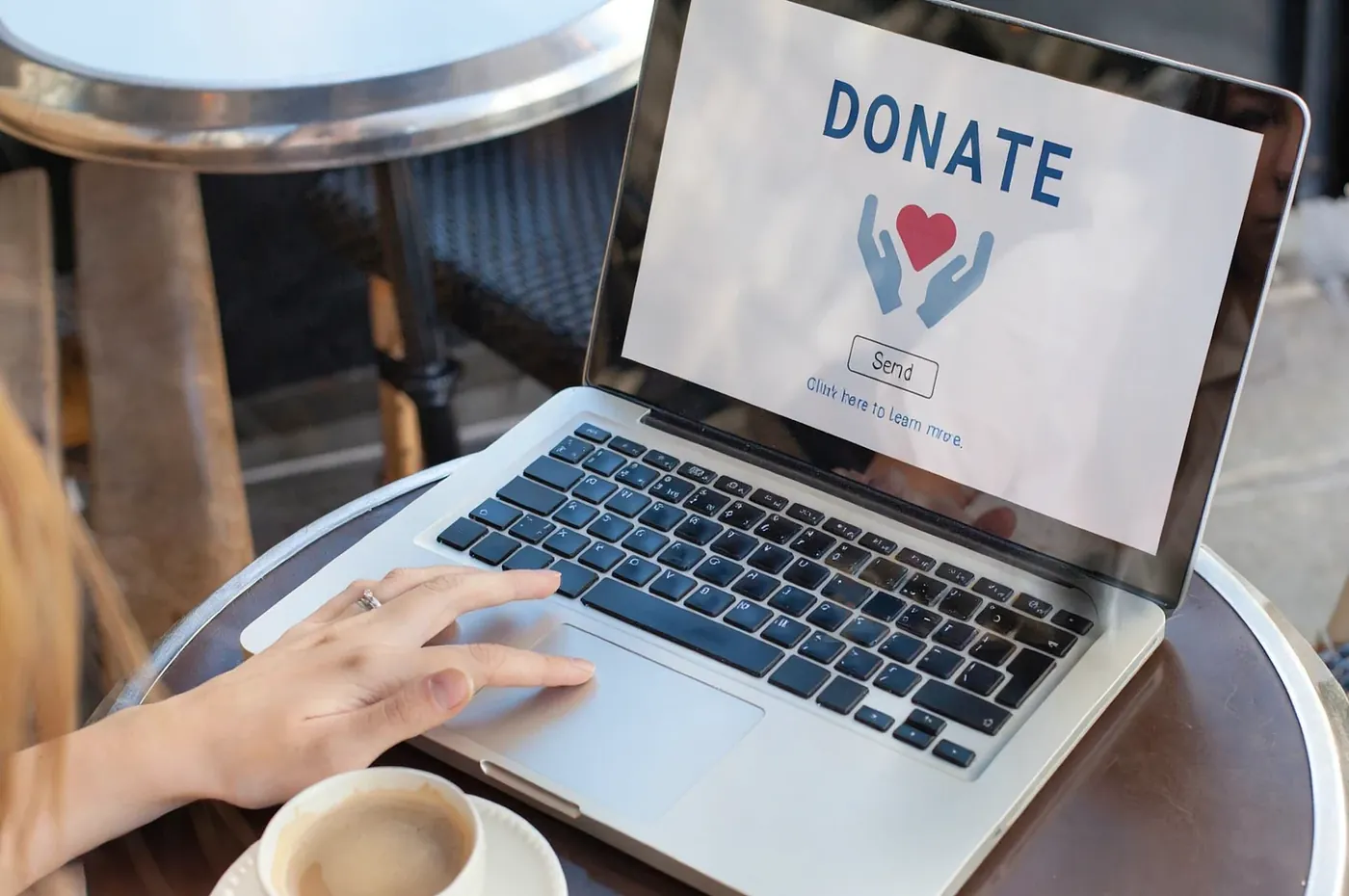 A laptop showing an online “Donate” page.