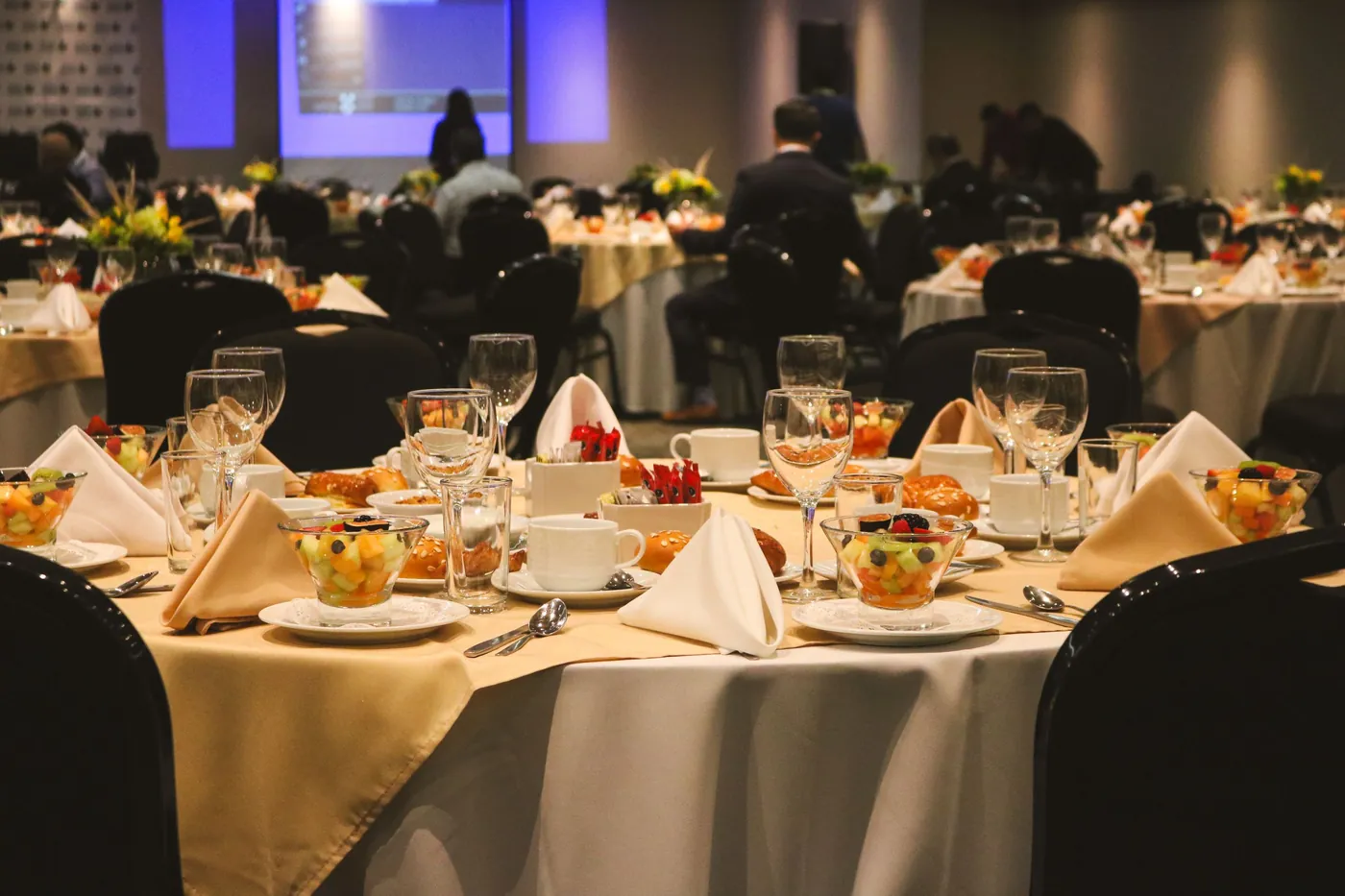 Banquet tables set for dinner.