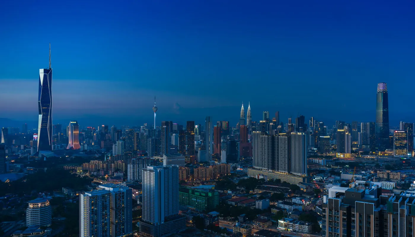 Kuala Lumpur skyline at dusk, with the KL Tower among the city’s towers.