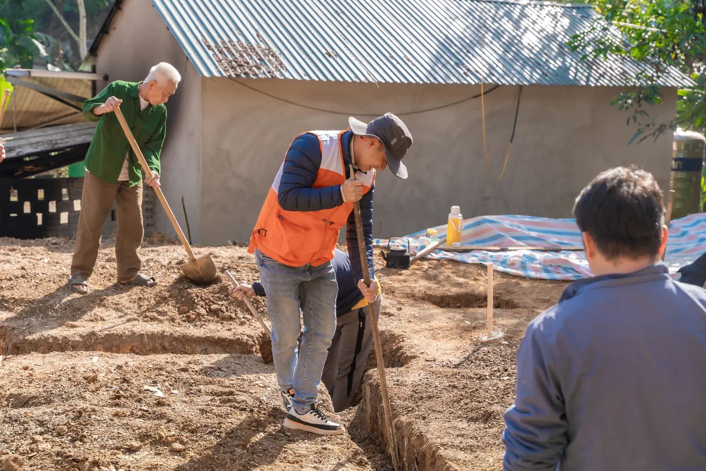People working together on a community construction project.